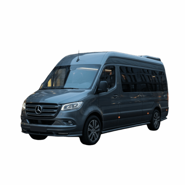 Exterior view of a luxury charcoal grey Mercedes-Benz Sprinter Jet-Van parked on a cobblestone street in front of a modern executive building, perfect for high-capacity 9-passenger professional chauffeur and limousine services.