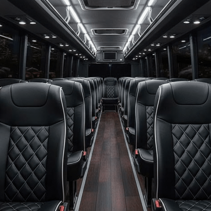 The modern interior of a 36-passenger mini coach bus with large panoramic windows.